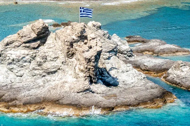 Greek flag on a rock in south Crete