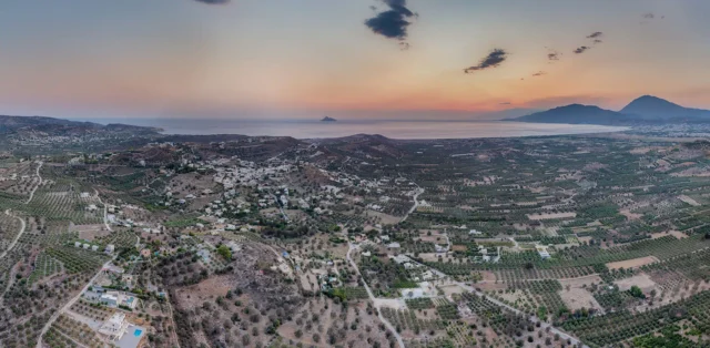 Metochi and Kamilari after sunset with a view to Messara bay, Paximadia and Gavdos